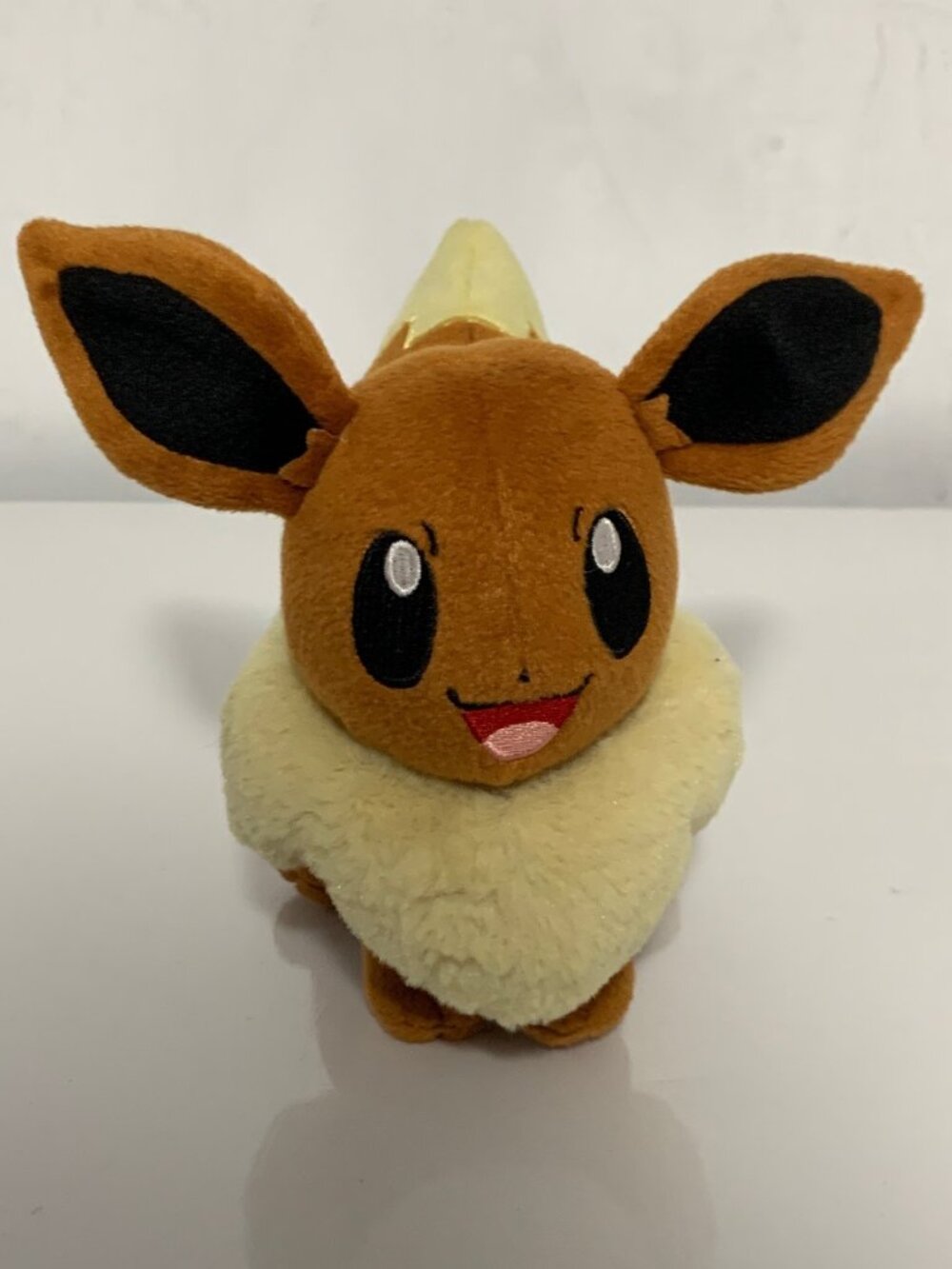 Pokemon Tomy Eevee 2016 Plush signature brown fur and a plush, cream-colored col
